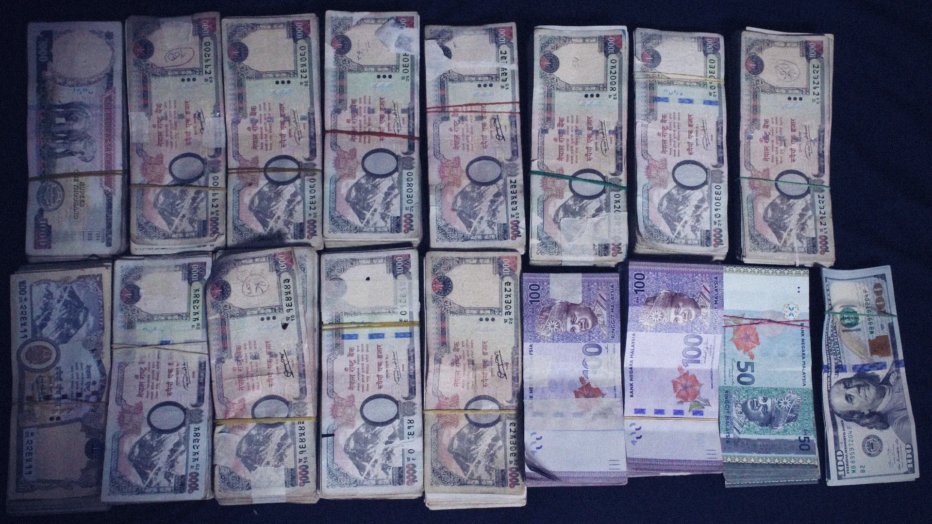 Airport Security Arrests Two Bangladeshi Nationals with Illegal Currency