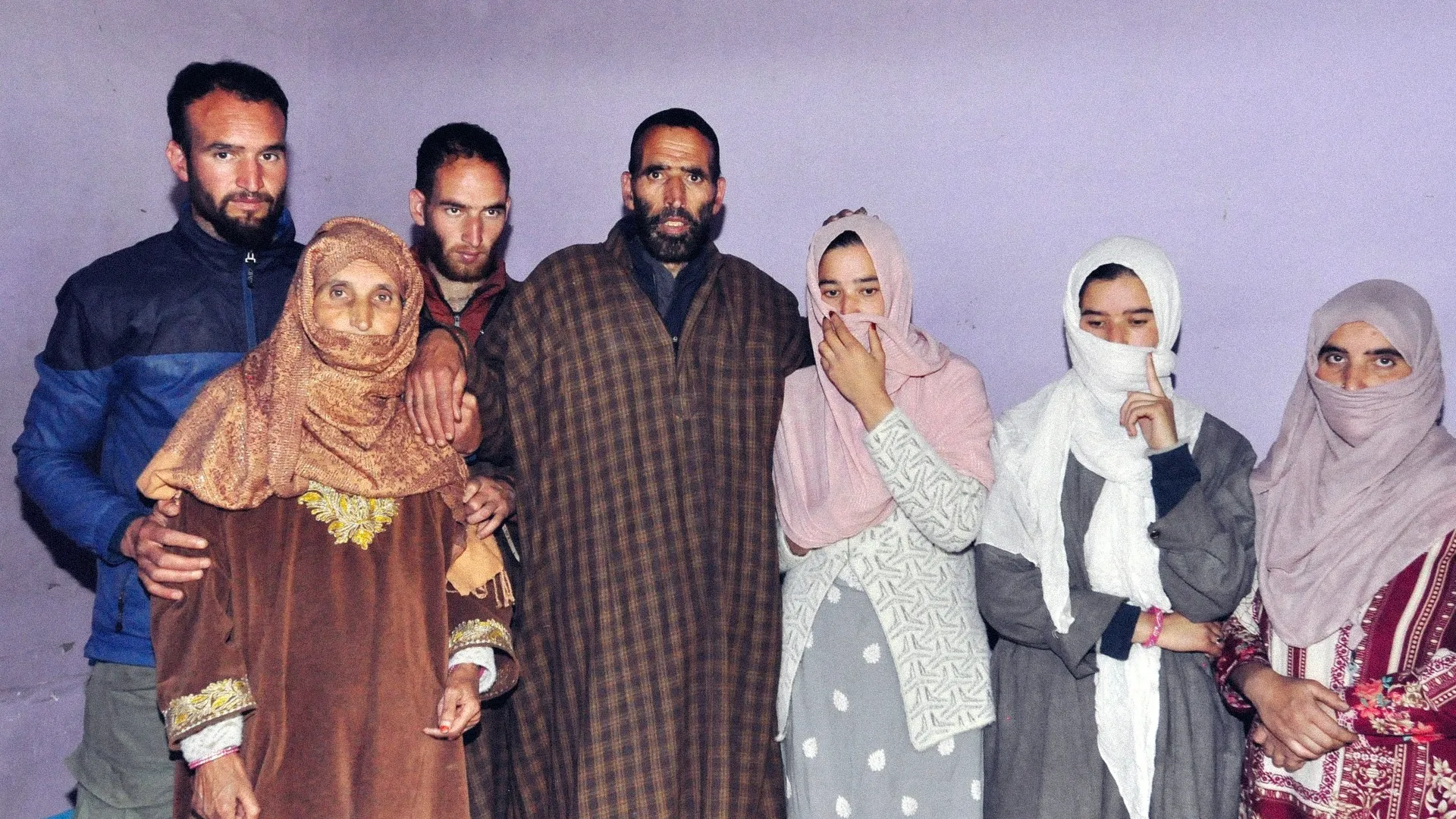 Syed Adil Hussain Shah (center), who died while attempting to save tourists during the Pahalgam attack, pictured with his family members.